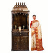 Decorative wooden cabinet with intricate carvings and a woman in a saree on a white background.
